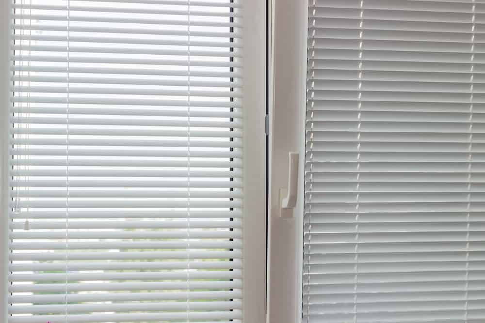 Venetian blinds in door.